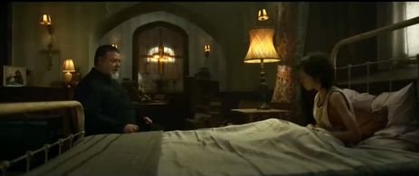 Russell Crowe and Peter DeSouza-Feighoney in The Pope's Exorcist (2023)