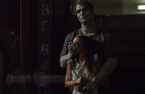 Lily (Lillian Blankenship) held captive by zombie Max (Johnathan Schaech) in 'Day of the Dead: Bloodline (2017)'.
