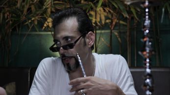 Aaron Palermo as ASAD in GAME ON: TIME TO PULL THE STRINGS