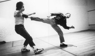 Jean-Claude Van Damme and Magic Schwarz in Lionheart (1990)