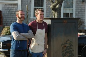 Mr. Gibbs and Harry posing for a photograph taken by the local journalist, Joy. (Adam Pascal, Tate Donovan)