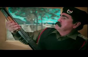 James Evans as Saddam Hussein in the music video 