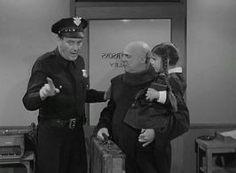 Jackie Coogan, Lisa Loring, and Ray Kellogg in The Addams Family (1964)