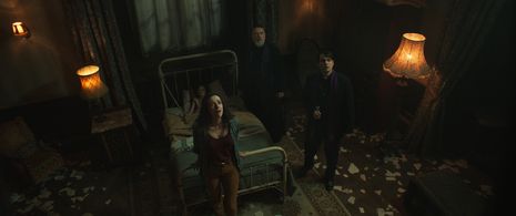 Russell Crowe, Peter DeSouza-Feighoney, Alexandra Essoe, and Daniel Zovatto in The Pope's Exorcist (2023)