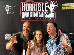Kevin enjoys some red carpet fun with co-star, Sara Fletcher and director, Bears Rebecca Fonté, at the Horrible Imaginin
