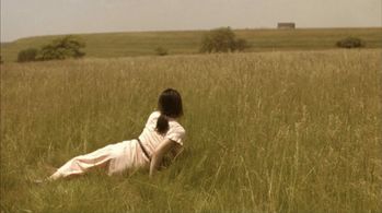 Kim Jiang Dubaniewicz as Christina's World by Andrew Wyeth in Tie a Yellow Ribbon