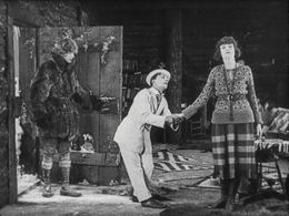 Buster Keaton, Bonnie Hill, and Freeman Wood in The Frozen North (1922)
