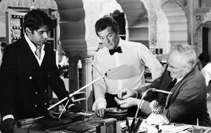 Roger Moore, Desmond Llewelyn, and Vijay Amritraj in Octopussy (1983)