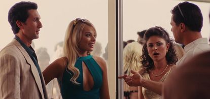 Leonardo DiCaprio, Margot Robbie, and MacKenzie Meehan in The Wolf of Wall Street (2013)