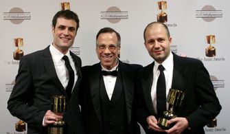 Special achievement award winners Brian McLean and Martin Meunier surround presenter Frank Gladstone