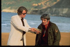 Michael Caine and Amerigo Tot in Pulp (1972)