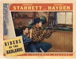 Charles Starrett and Ilene Brewer in Riders of the Badlands (1941)