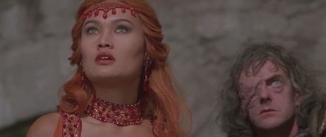 Tia Carrere and Edward Tudor-Pole in Kull the Conqueror (1997)