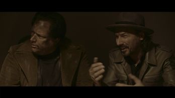 Clive (Eric McGraw) explains as Frank (Frank H. Cutler) looks on in support in 