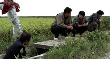 Song Kang-ho, Kim Sang-kyung, and Roe-ha Kim in Memories of Murder (2003)
