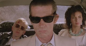 John Hurt, Tim Roth, and Laura del Sol in The Hit (1984)