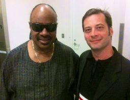 Claude Miles with musical genius Stevie Wonder.