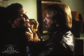Chuck Norris and Ron Henriquez in Code of Silence (1985)