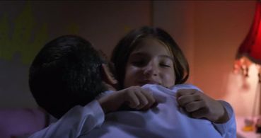 Frank Valera (Antonio Banderas) wishes his daughter, Olivia (Lillian Blankenship),goodnight with an 