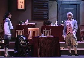 Peter Tedeschi, far left, as John Adams in 1776 as Adams confers with Dr. Lyman Hall.