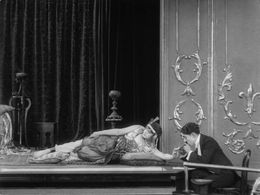 Charles Chaplin and May White in A Night in the Show (1915)