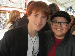 Justin Tinucci with Rico Rodriguez at the premiere of The Muppets November 12 2011 at the El Capitan Theatre, Hollywood.