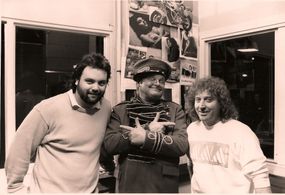 Director Jim Yukich and myself with Benny Hill at the shoot for Genesis' 