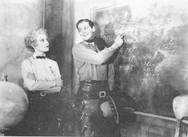 James Ellison and Muriel Evans in Three on the Trail (1936)