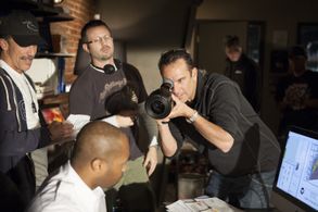 Dana and Ric Roman Waugh line up a shot on 