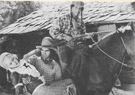 Leon Beaumon, Julie Bishop, and Frank Lackteen in Clancy of the Mounted (1933)
