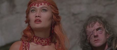 Tia Carrere and Edward Tudor-Pole in Kull the Conqueror (1997)