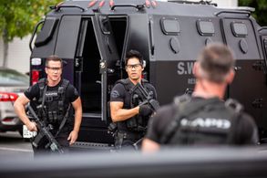 Michael Marc Friedman on the set of S.W.A.T. as Sgt. Becker with David Lim