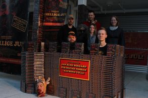 Some of the cast and crew, in a castle made of 