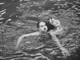 Charles Chaplin and Marta Golden in The Adventurer (1917)