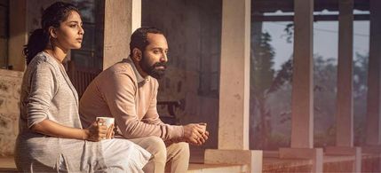 Fahadh Faasil and Aishwarya Lekshmi in Varathan (2018)