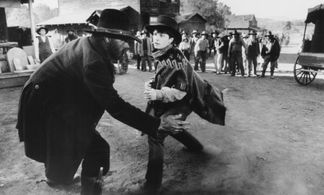 Michael J. Fox and Tom Wilson in Back to the Future Part III (1990)