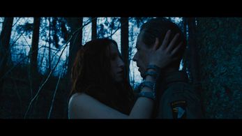 Anna Paliga (as Stria) and Fredrik Wagner (as Rucker) in Warhunt