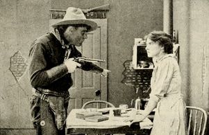 Pauline Bush and Jack Richardson in The Coward (1912)