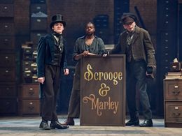 Young Marley and the Scrooge and Marley Sign