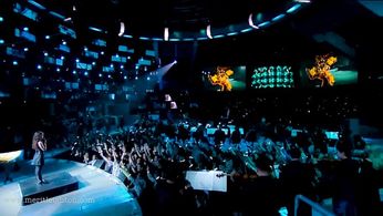 Merit Leighton on stage singing at the SPIKE TV VGAs- with Lorne Balfe and orchestra for GOTY tribute of Dishonored