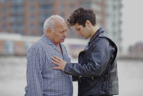 Still of Burt Young and Jacques Mitchell, in Tom in America