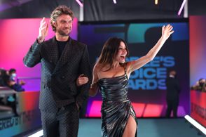 Sarah Shahi and Adam Demos