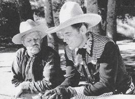 Harry Harvey and Fred Scott in Ridin' the Trail (1940)