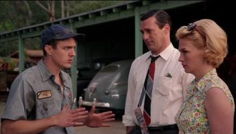 January Jones, Jon Hamm, and Lucius Baybak in Mad Men (2007)