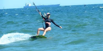 TV Personality Sabrina Parisi during a kitesurfing session in the Pacific Ocean