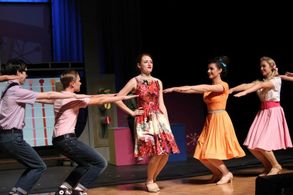 Natalie Von Kirk (in orange) as Brenda in Hairspray (2015)