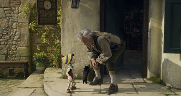 Tom Hanks and Benjamin Evan Ainsworth in Pinocchio (2022)
