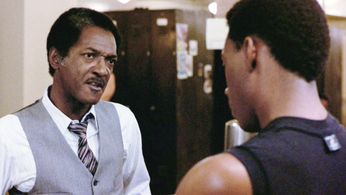 Eddie Murphy and Gilbert R. Hill in Beverly Hills Cop (1984)