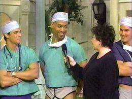 Roseanne Barr, Mario Cunha, Wes Ruffin, and Mathias Schar in The Roseanne Show (1997)