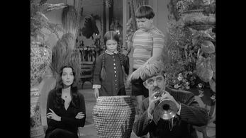 John Astin, Carolyn Jones, Lisa Loring, and Ken Weatherwax in The Addams Family (1964)